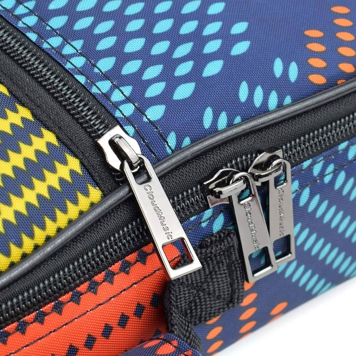 Zipper close-up with metal pulls on colorful patterned ukulele gig bag pocket