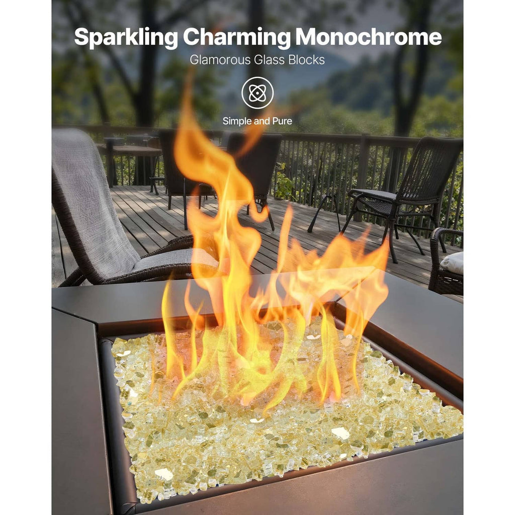 Gold fire pit glass rocks with flames in a tabletop fire pit