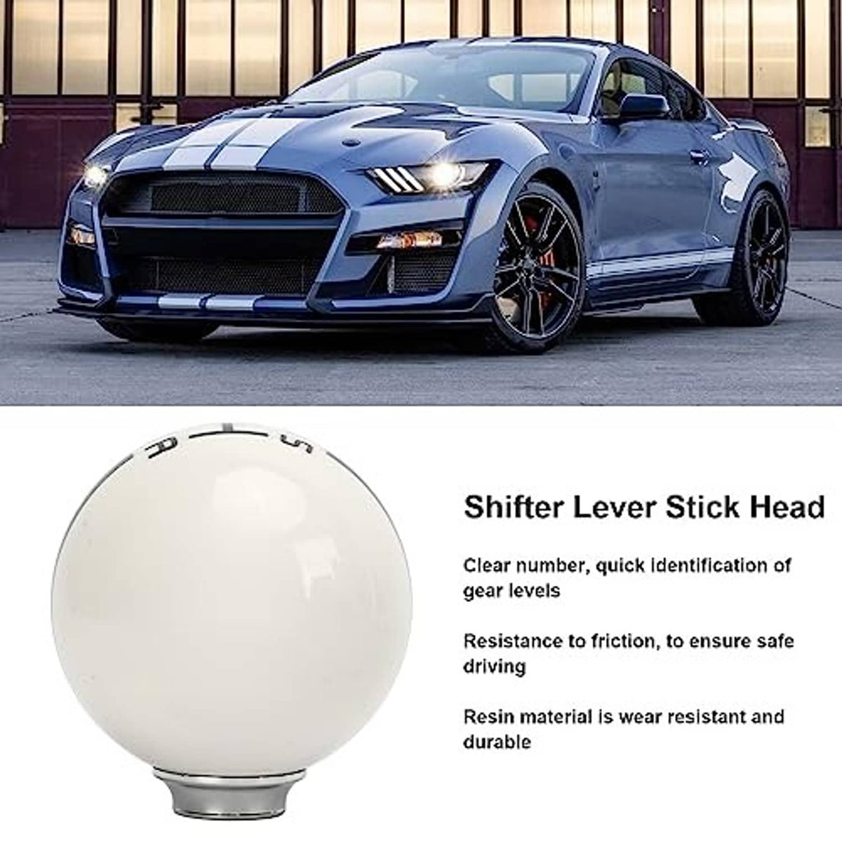 Manual shift knob with white top and chrome stem on center console