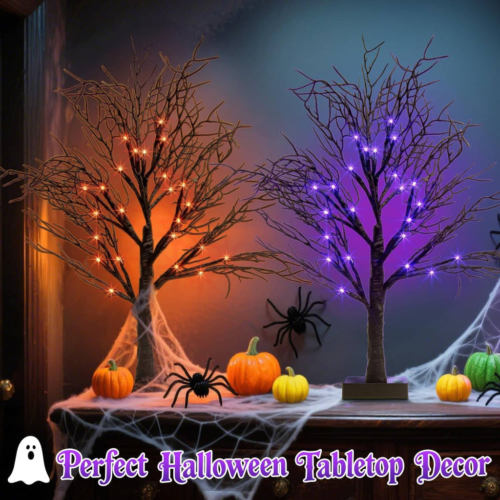 Pair of lighted Halloween decorative trees with orange and purple LED lights on bases