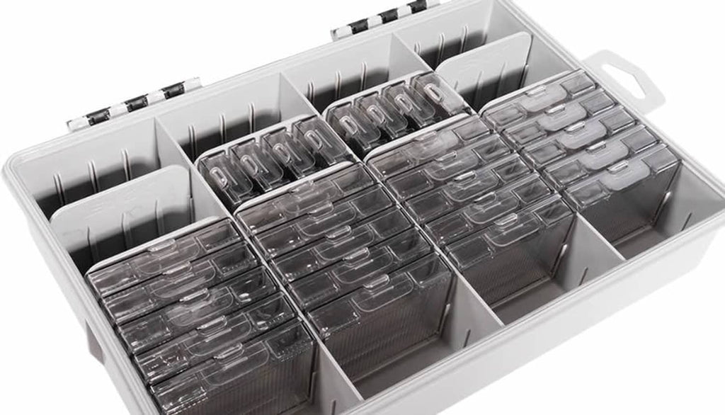 Open tackle storage kit with divider slots and neatly arranged stacked rectangular metal boxes