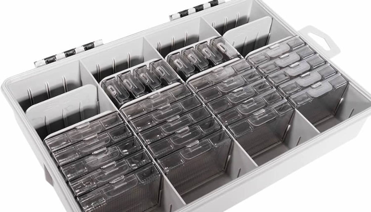 Open tackle storage kit with divider slots and neatly arranged stacked rectangular metal boxes