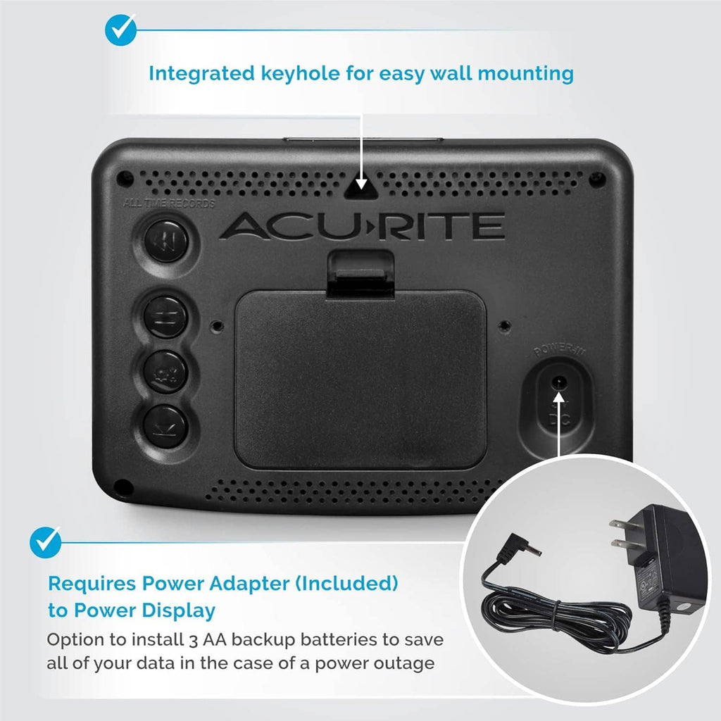 Weather station back with wall-mount keyhole, battery door, and included power adapter