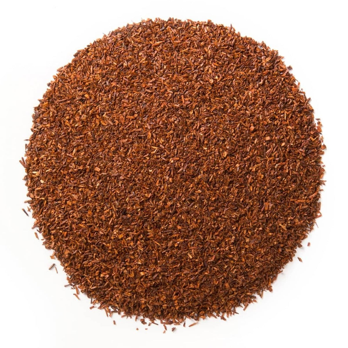 Loose leaf rooibos tea, small brown aromatic leaves in a round pile