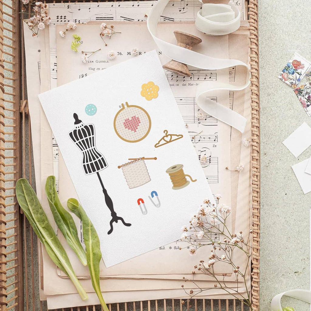 Sewing-themed metal cutting die cards with colorful sewing tools, thread, and hearts
