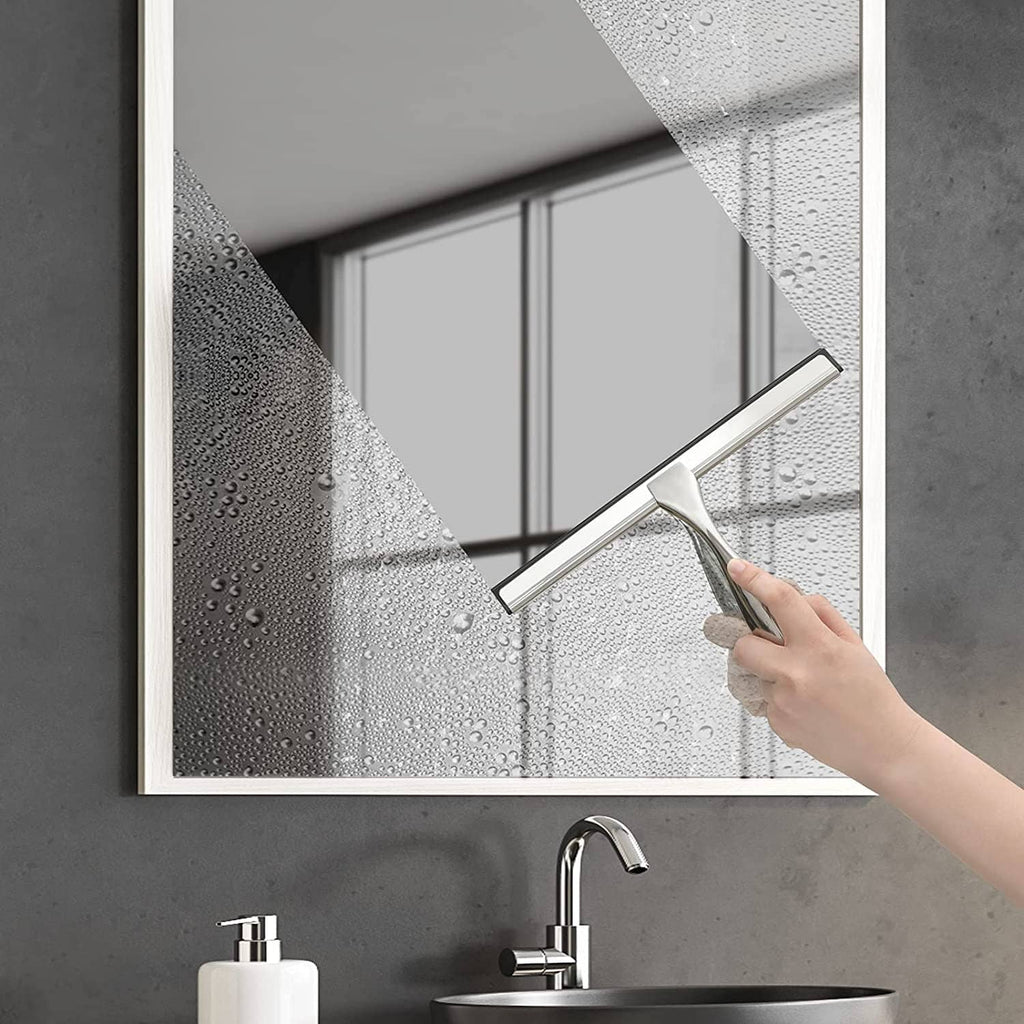 Window squeegee with silver frame and black rubber edge, hand cleaning wet glass