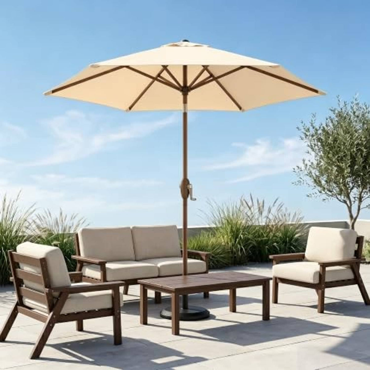 Outdoor patio umbrella with khaki canopy above seating set and table