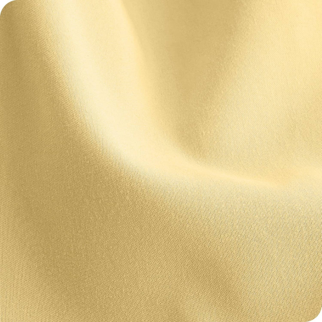Microfiber fabric close-up in pale yellow with smooth woven texture