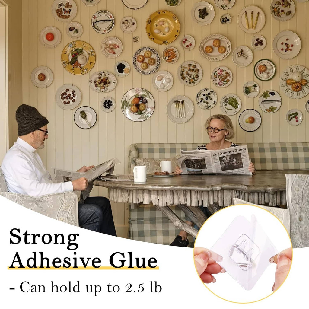 Invisible adhesive plate hanger holding a plate to the wall with a metal triangle clip
