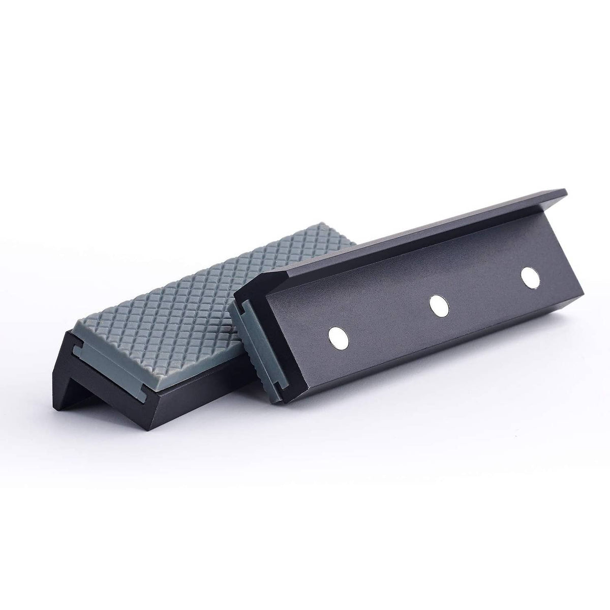 Soft vice jaw pad cover with textured light-gray insert and dark mounting plate with two holes