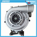 Turbocharger with silver housing and black turbine wheel, side view