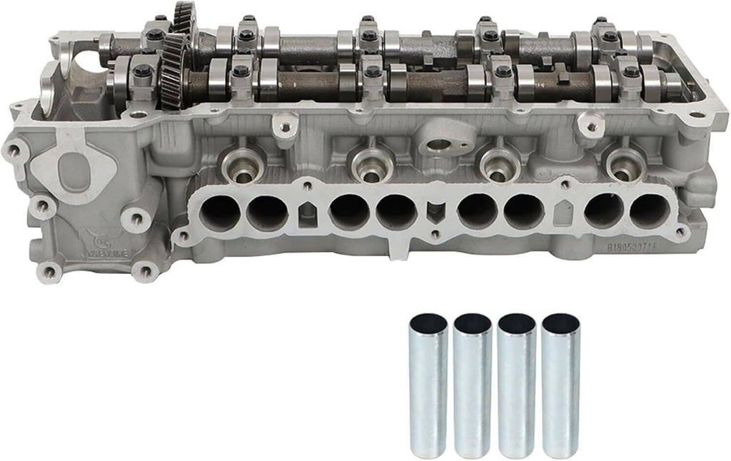 Gray cylinder head with camshafts, rocker hardware, and multiple intake/exhaust ports