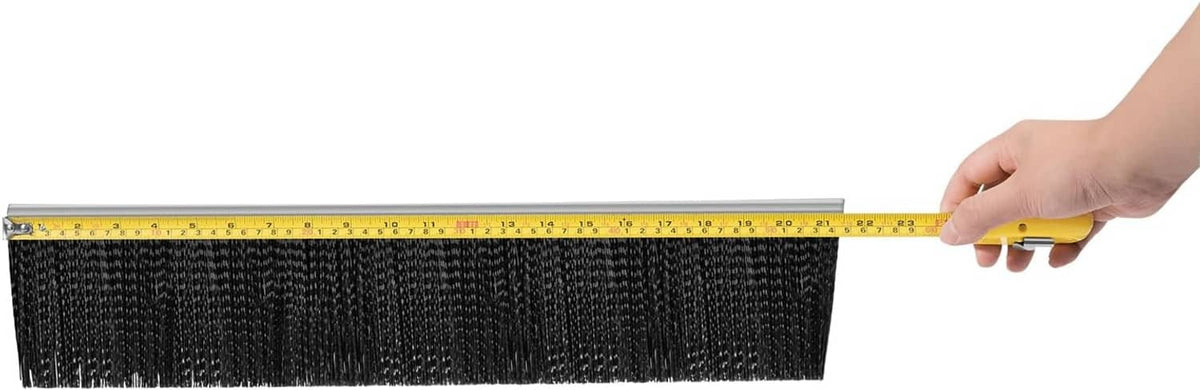 Lawn sweeper replacement brush measured with a yellow tape along the gray mounting bar