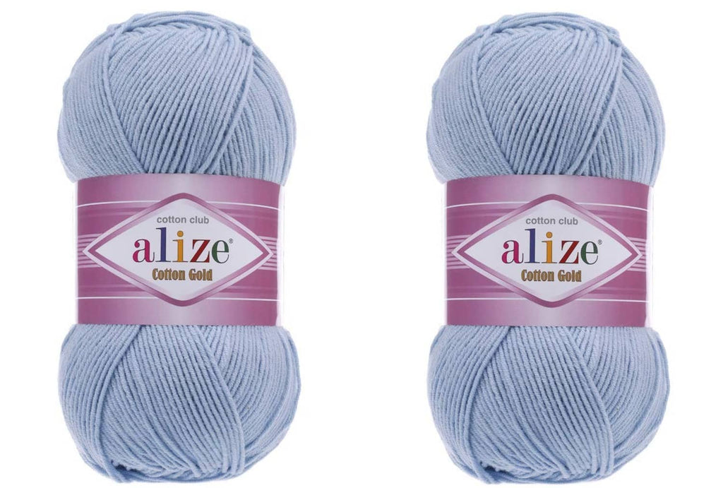 Cotton Gold yarn in light blue, 2 skeins in a purple label