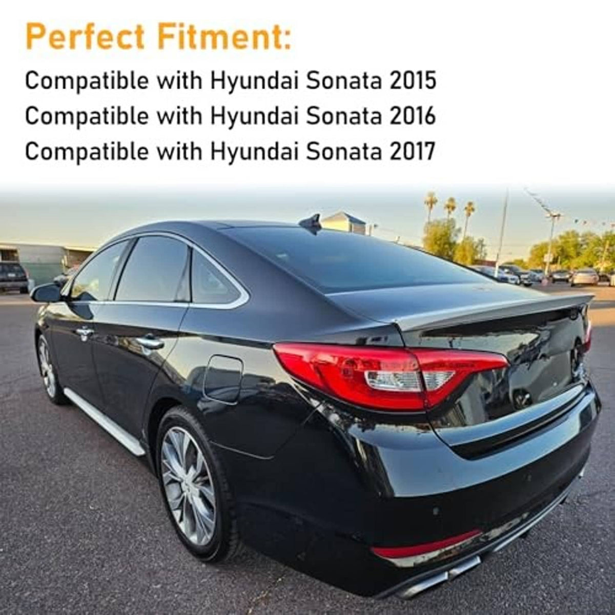 Red rear bumper reflector on black car rear bumper