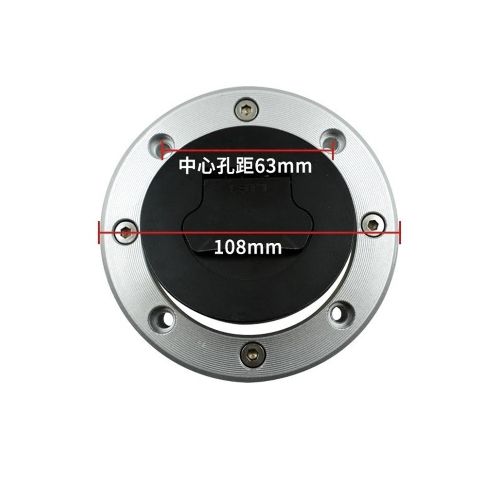 Fuel gas cap with black center insert and silver mounting ring with screw holes