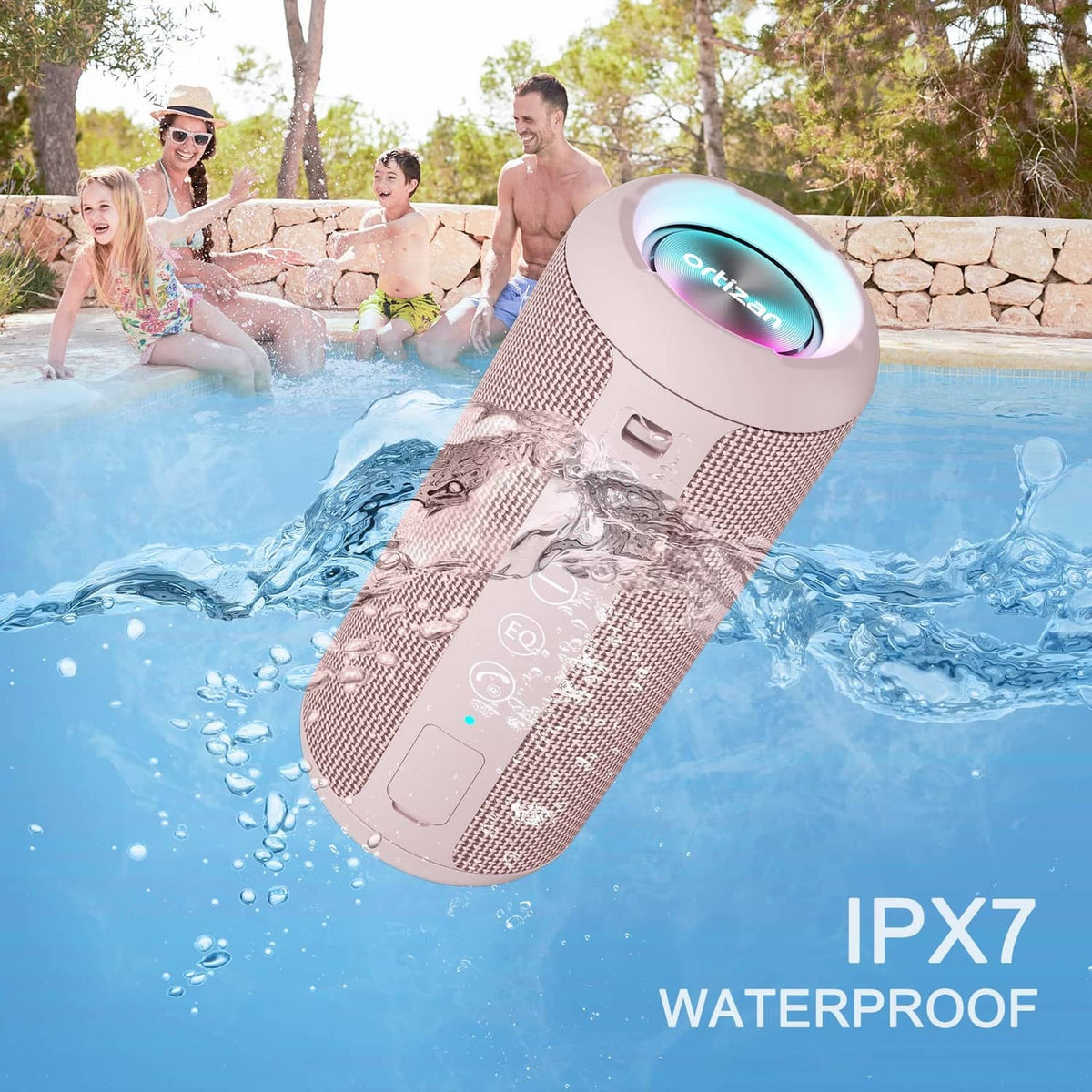 Pink portable Bluetooth speaker in pool water with splash effects