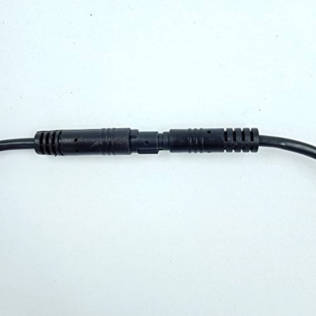 Black dash cam extension cable with inline connector and ribbed strain relief