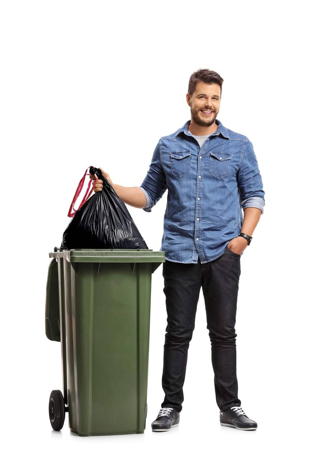 Black drawstring trash bag held in hand for a large trash can