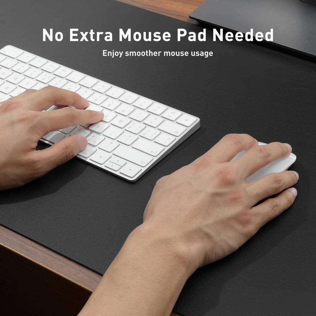 Black desk pad with textured surface for keyboard and mouse use