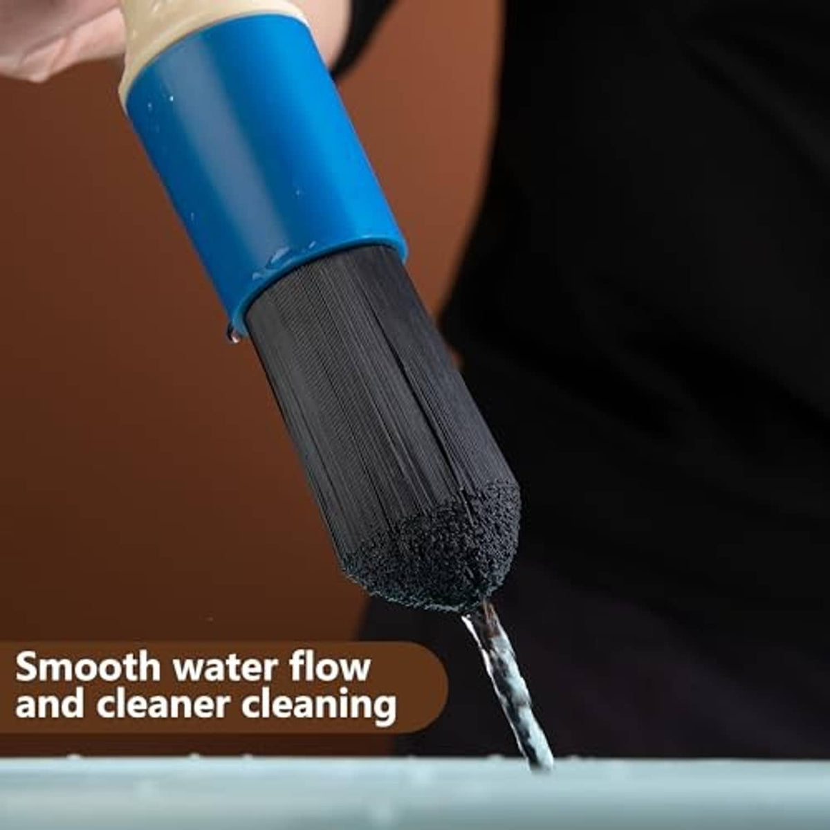 Blue bristle brush head attached to hose, spraying water for parts cleaning