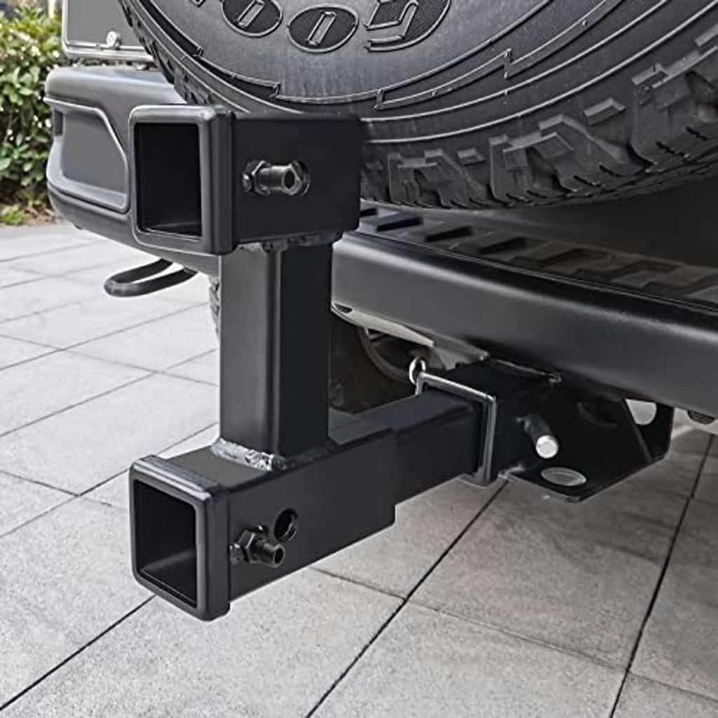 Installed black dual receiver hitch riser on vehicle with pin-hole safety opening