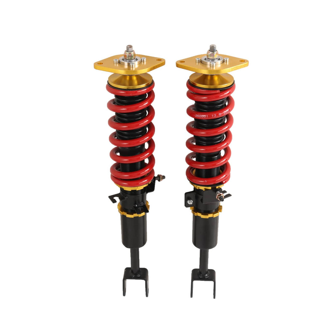 Front view of two adjustable coilovers: red springs, black dampers, gold top plates