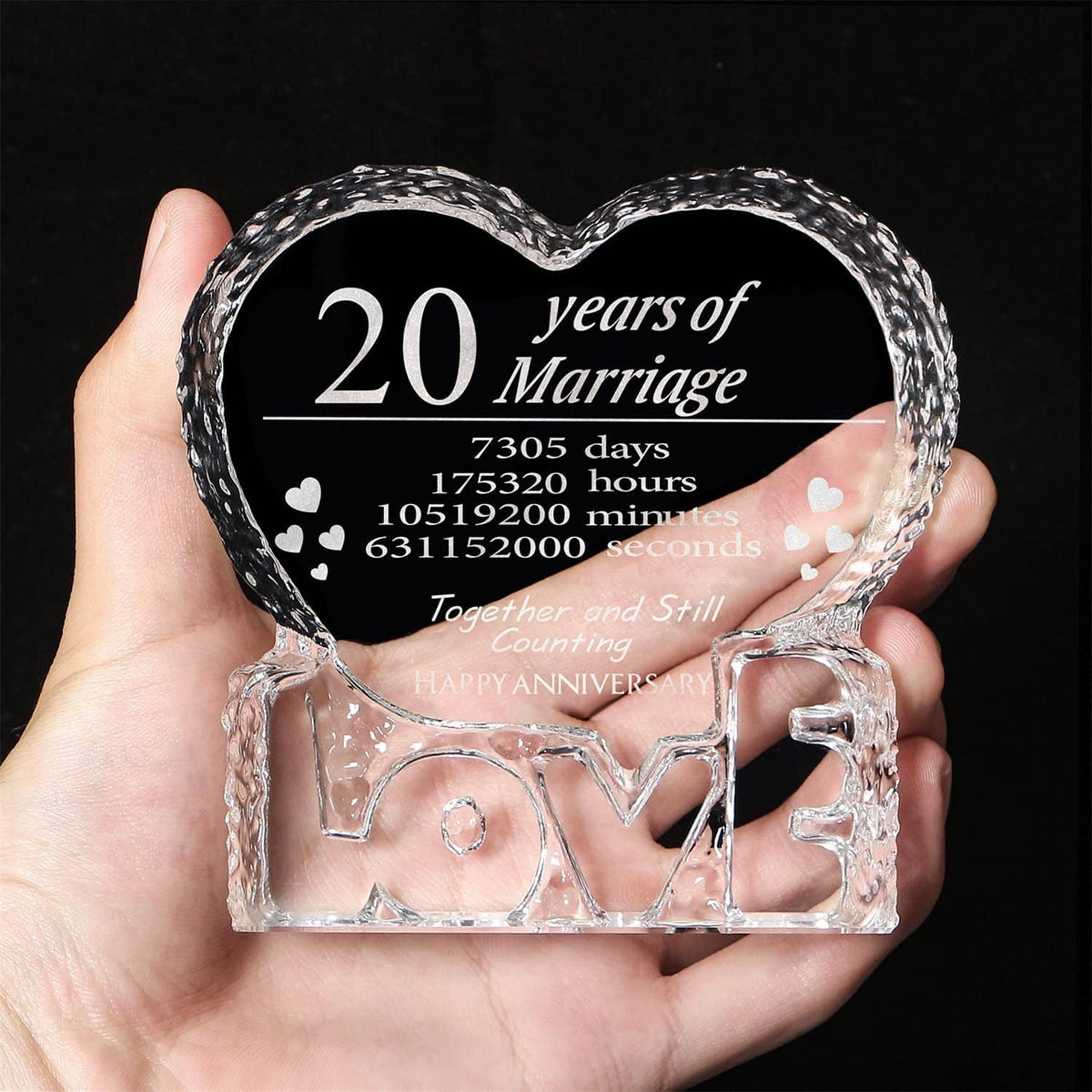 Engraved crystal heart keepsake held in hand, black panel reading 20 years of Marriage
