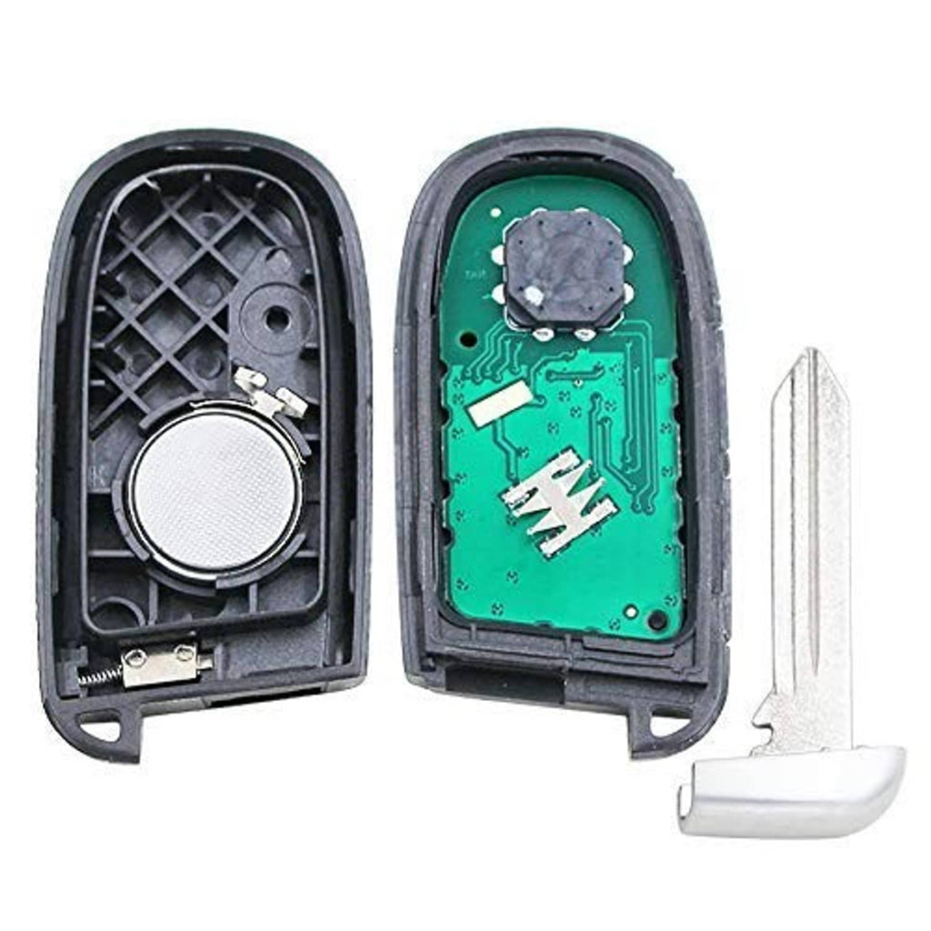 Key fob remote interior parts: dark housing, green PCB with components, and key blade.