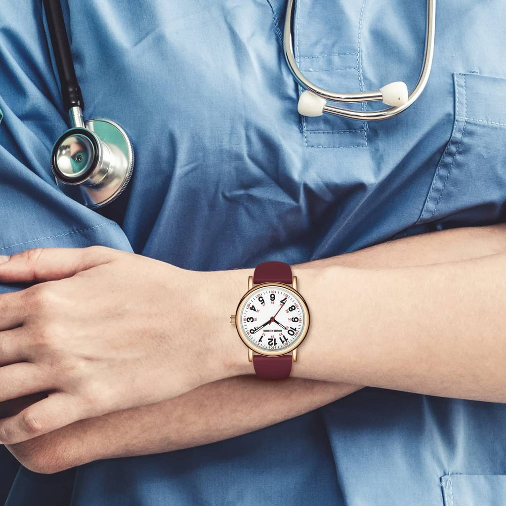 Nurse watch on wrist with wine-red strap and rose-gold case, white dial with red markers