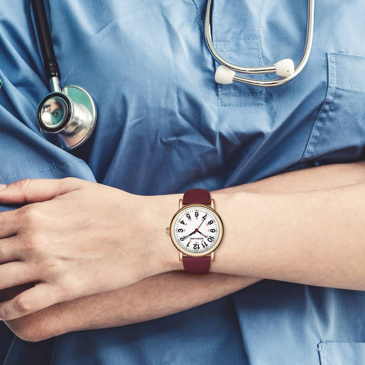 Nurse watch on wrist with wine-red strap and rose-gold case, white dial with red markers