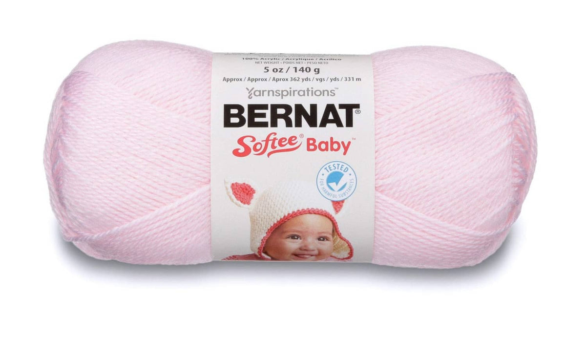 Light pink Bernat Softee Baby yarn skein with label, Oeko-Tex certified for baby crafts.