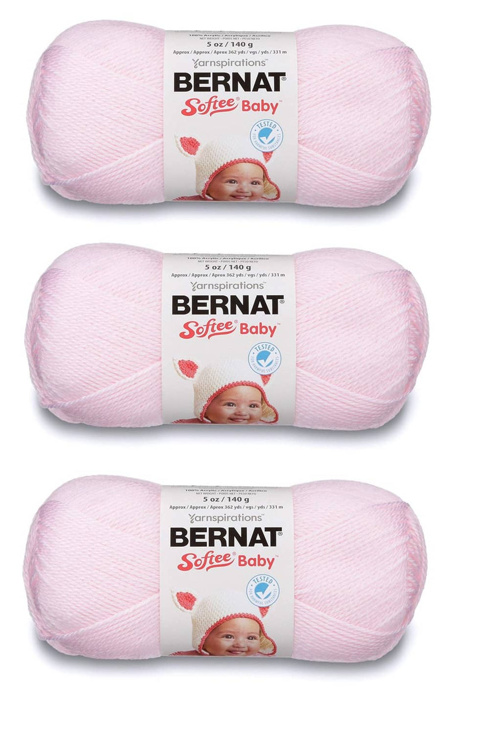 Light pink Bernat Softee Baby yarn skeins on display, labeled for knitting and crochet.