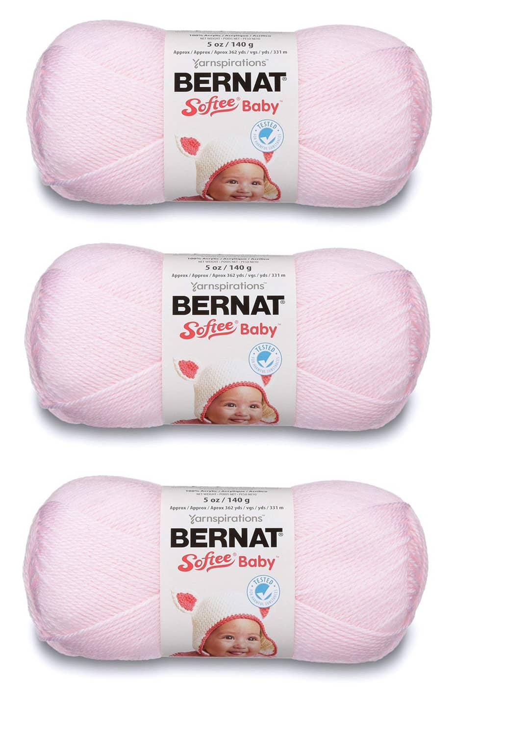 Light pink Bernat Softee Baby yarn skeins on display, labeled for knitting and crochet.