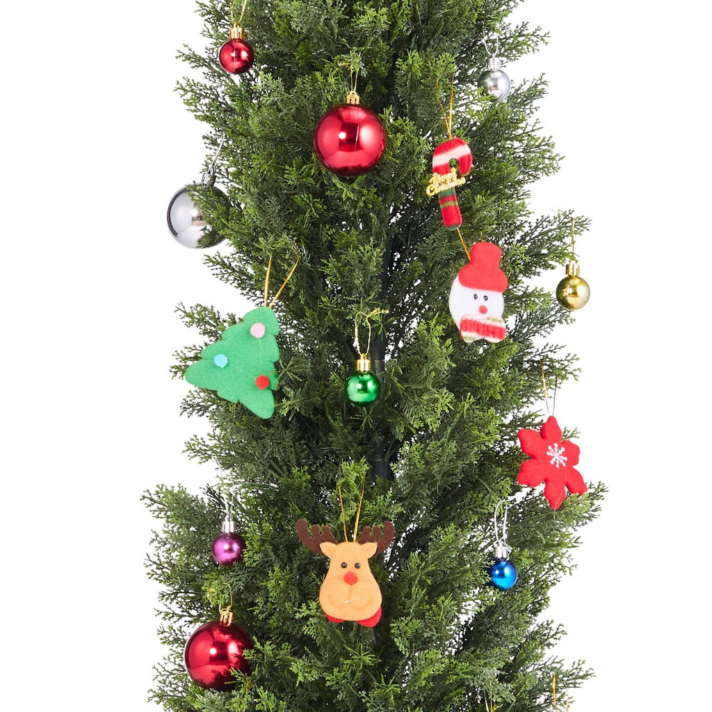 Artificial cedar tree with red, gold and character ornaments