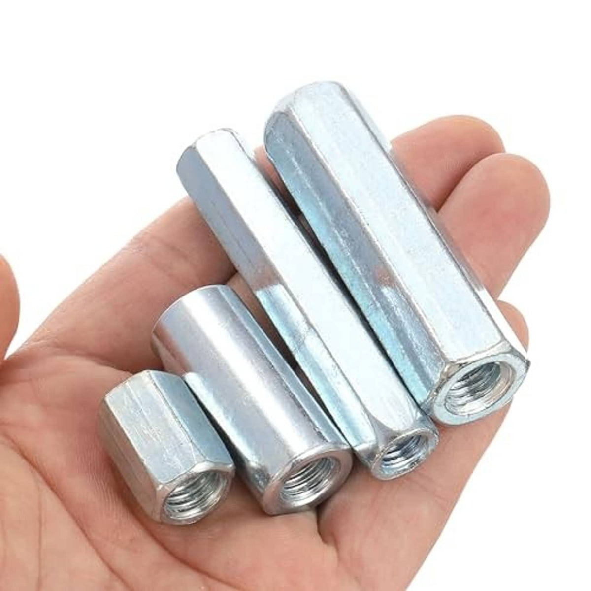 Galvanized hex coupling nuts held in hand, visible internal threaded hole