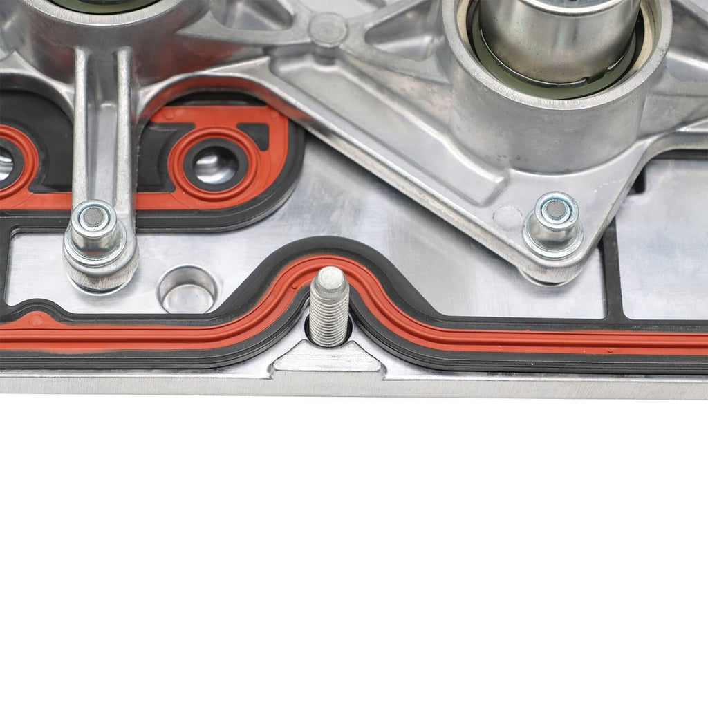 Valve cover gasket area with orange seals, bolts, and mounting brackets