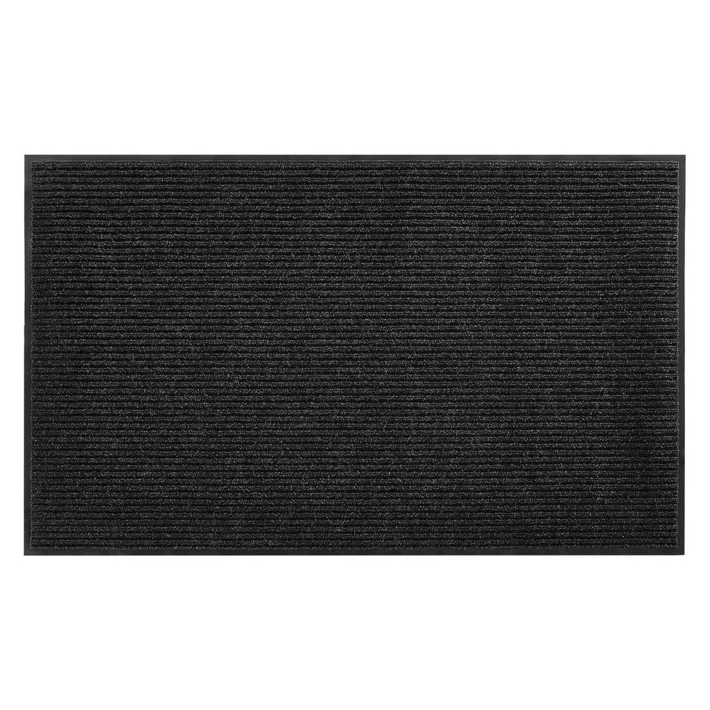 Close-up of dark ribbed front door mat surface with textured pile