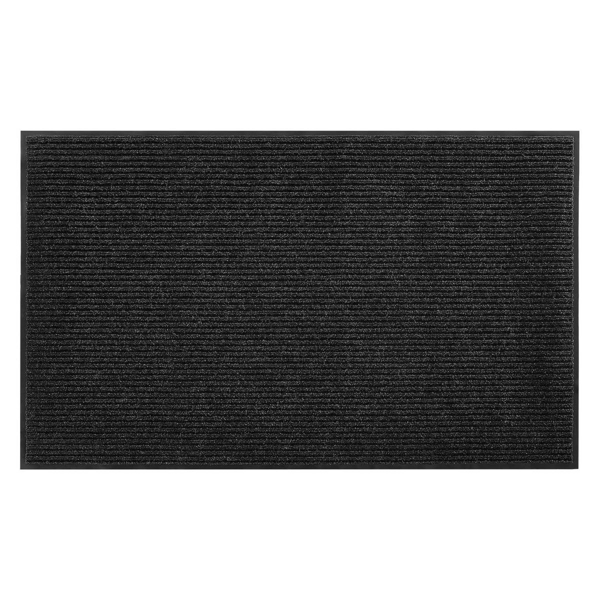 Close-up of dark ribbed front door mat surface with textured pile