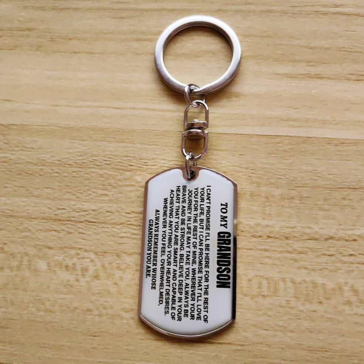 Silver dog-tag keychain on a round keyring, engraved inspirational text