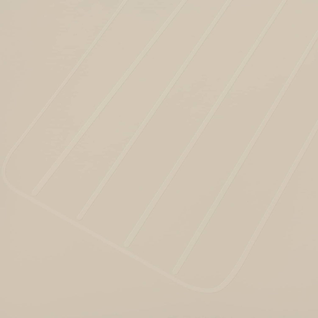 Close-up of light beige molded seat back cover texture and panel lines