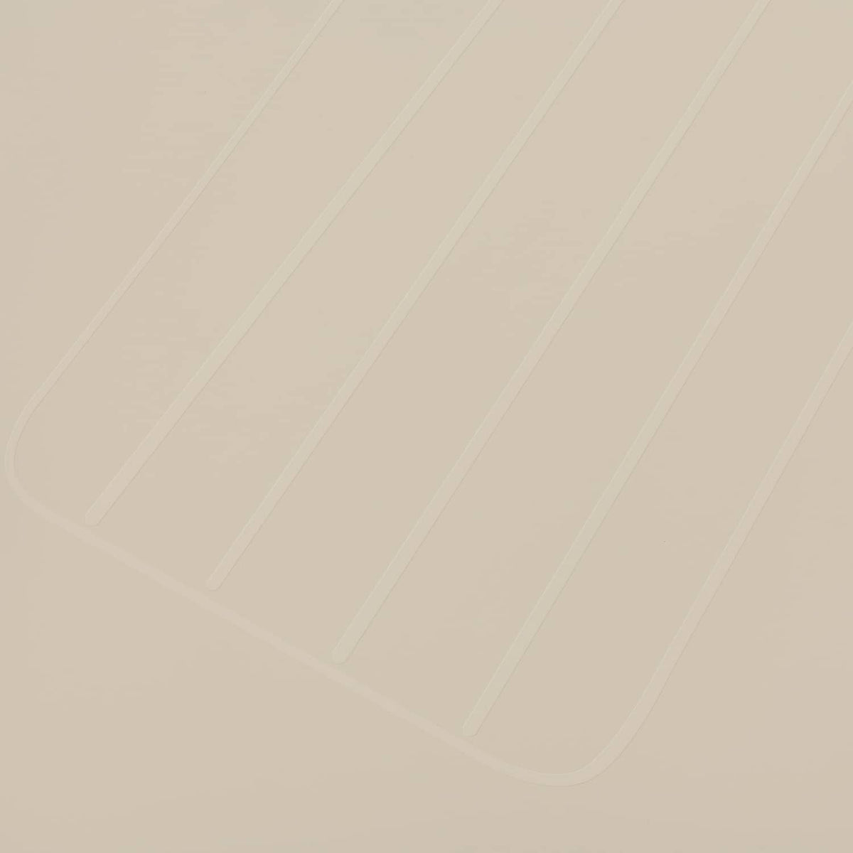 Close-up of light beige molded seat back cover texture and panel lines