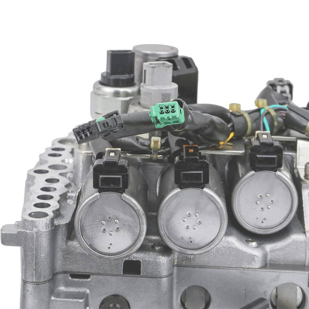 CVT transmission control valve body with solenoids, front view of three round solenoid covers