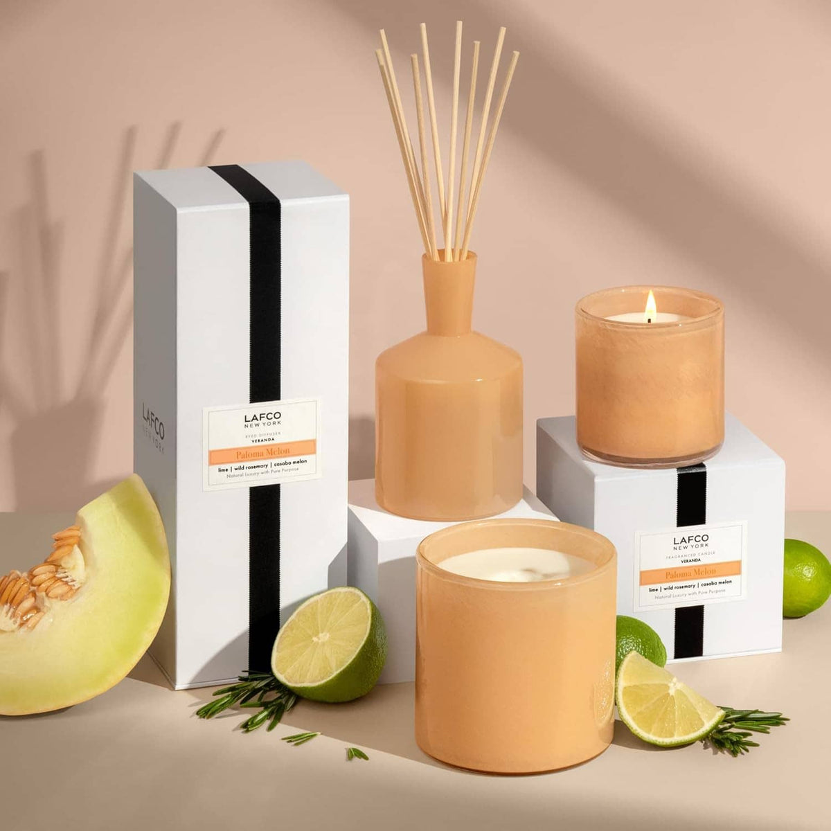 Assorted LAFCO candles with amber glass wicks and gift boxes with black ribbon stripe.