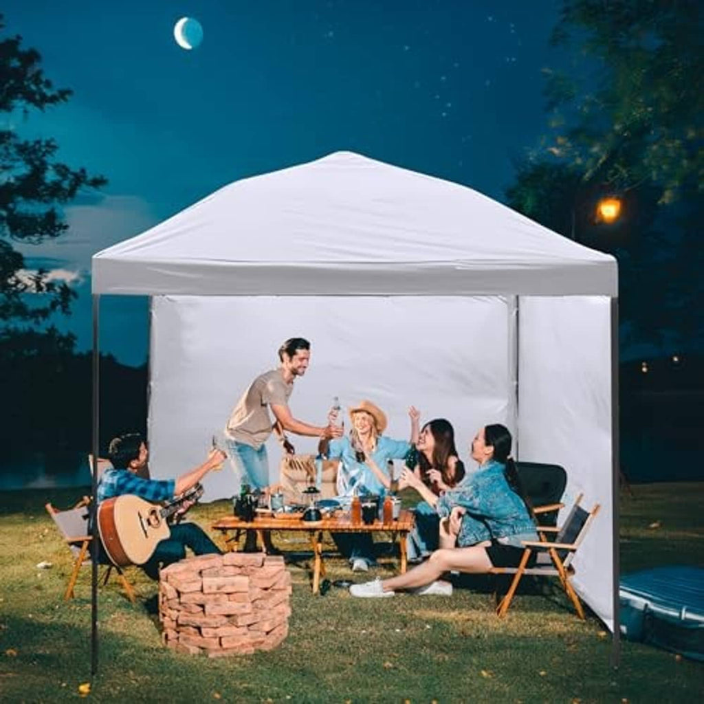 White pop up canopy top providing shelter over outdoor seating
