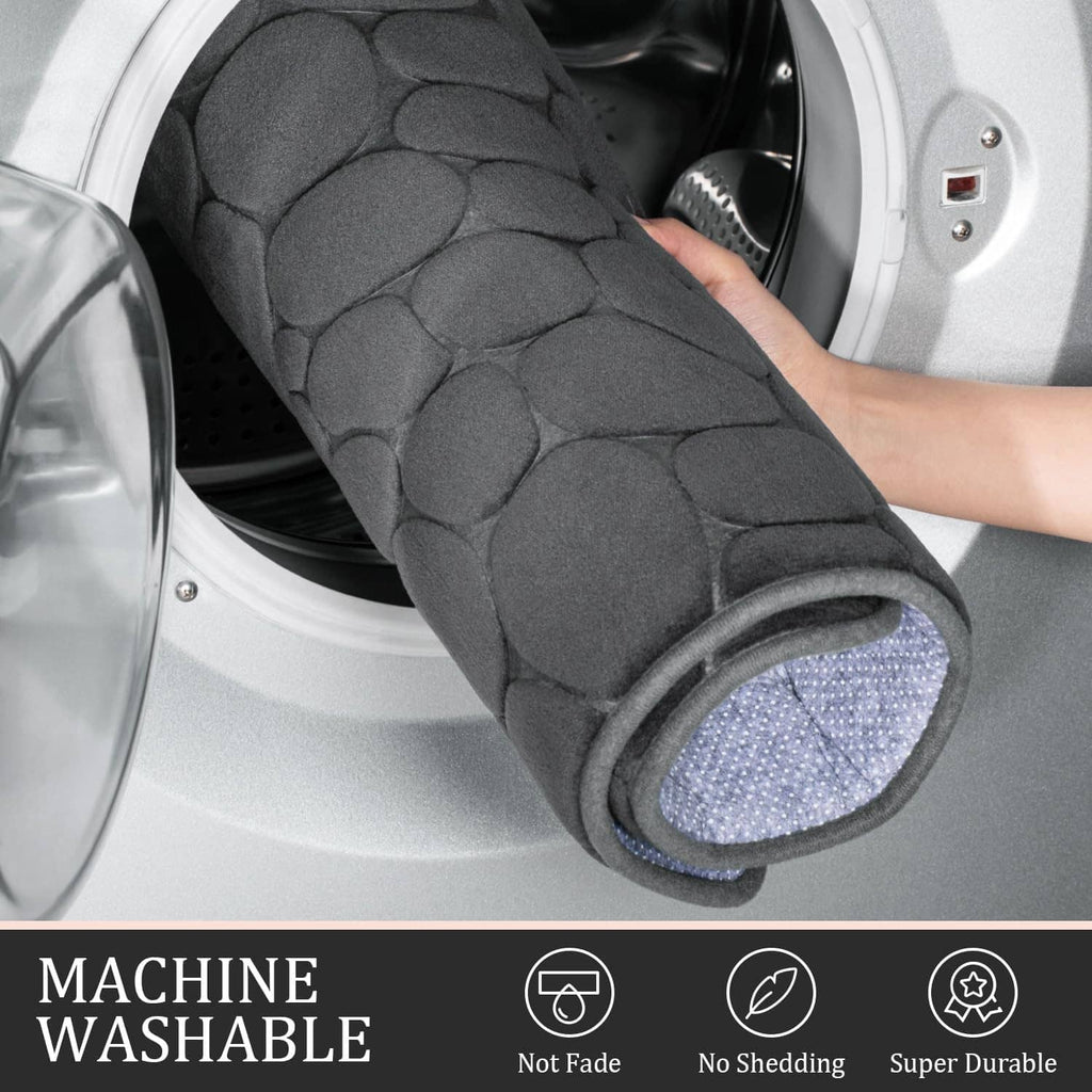Dark grey bath rug mat roll-up close-up with pebble-texture fabric edge