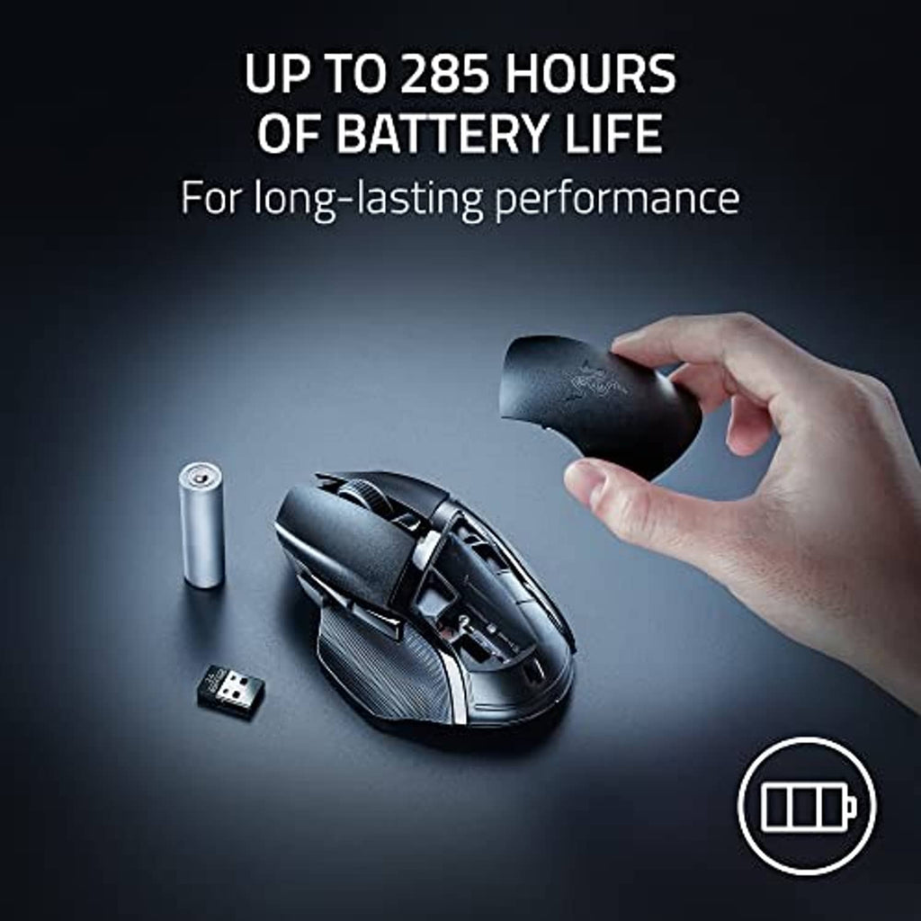 Wireless gaming mouse with green accent, side hatch open near a hand