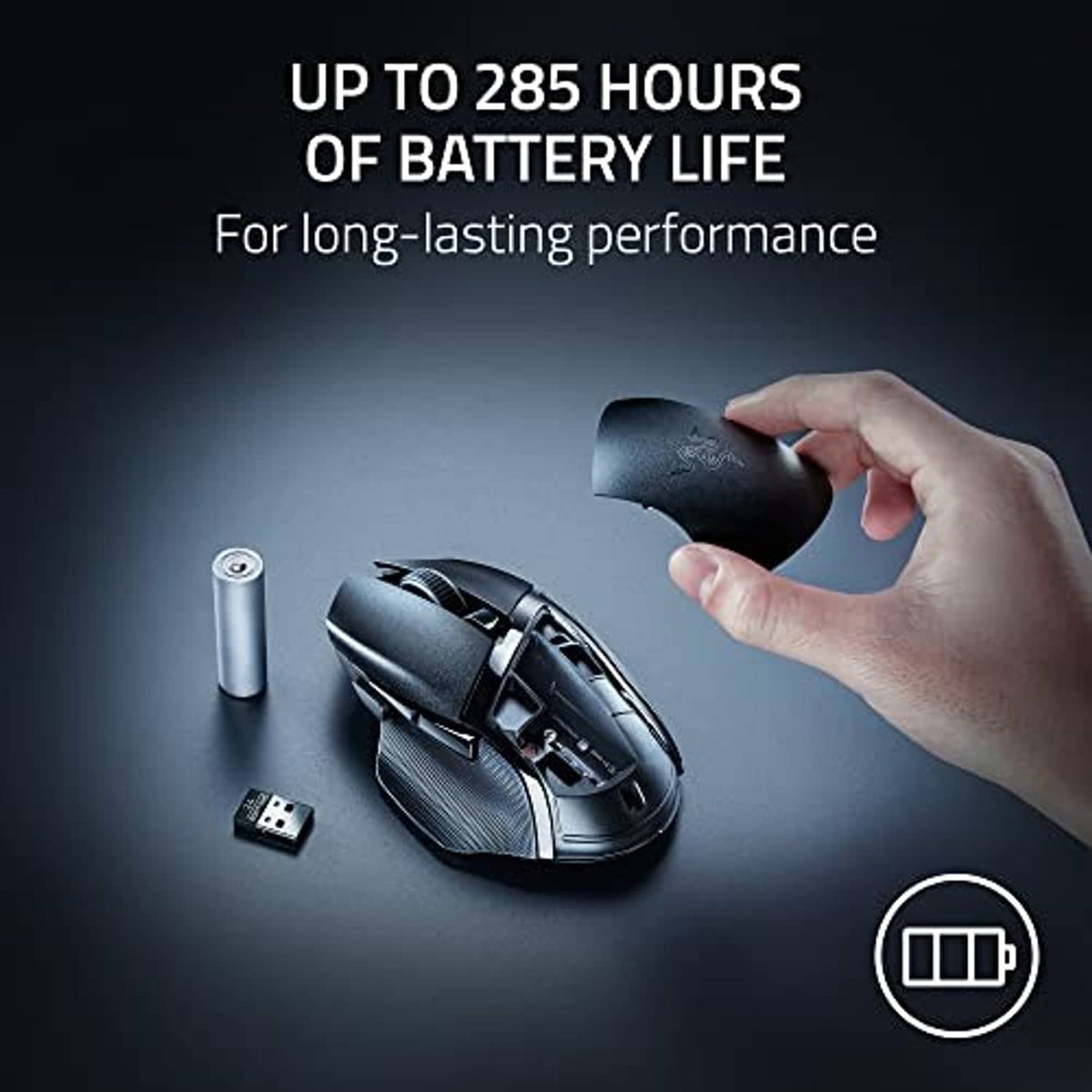 Wireless gaming mouse with green accent, side hatch open near a hand