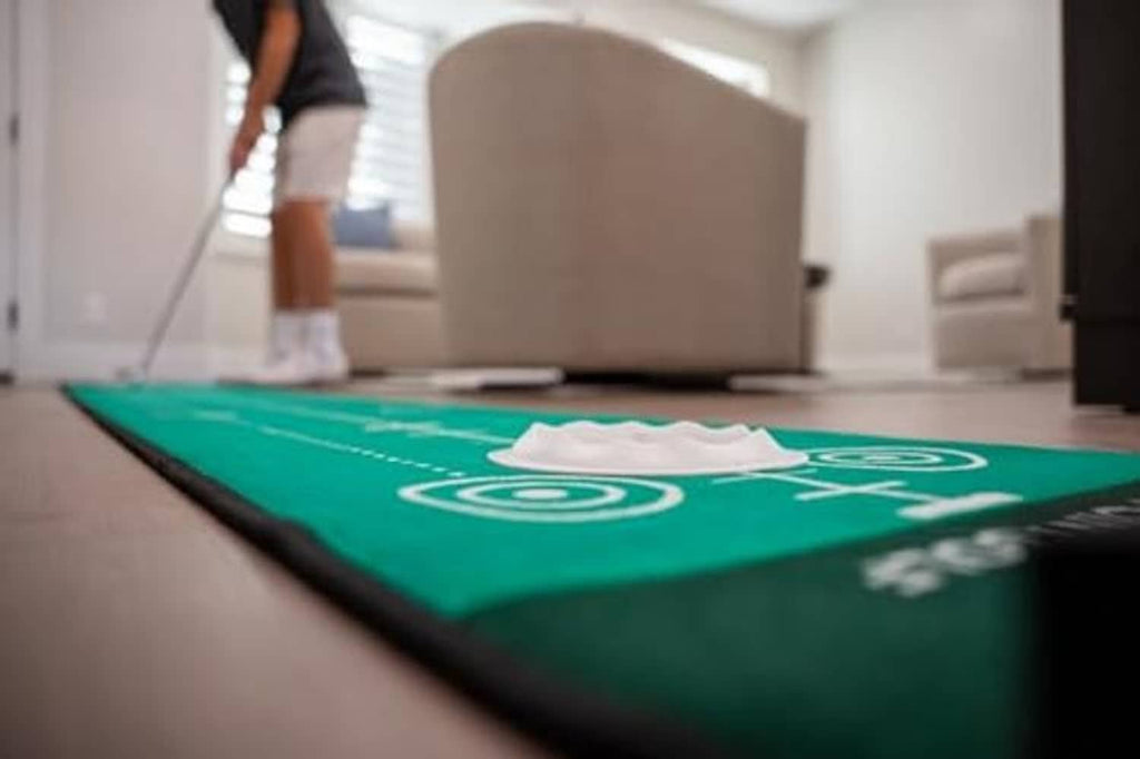 Green putting mat close-up with white target circle and alignment line