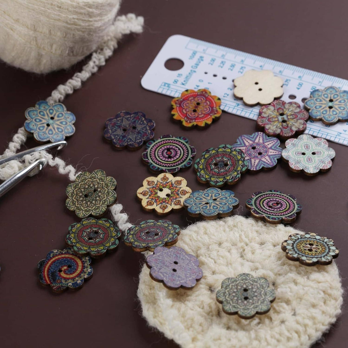 Two-hole wooden flower buttons, mixed colors, laid out beside a fabric measuring ruler